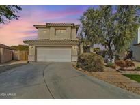 Charming two-story home featuring a well-manicured lawn and an attached two-car garage at 3906 N 297Th Cir, Buckeye, AZ 85396