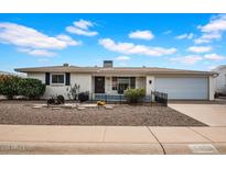 Charming single-story home with well-maintained landscaping and a welcoming front yard at 6329 E Dodge St, Mesa, AZ 85205