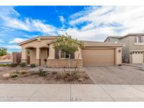 Charming single-Gathering home featuring a landscaped front yard and a two-car garage in a desirable neighborhood at 65 W Cucumber Tree Ave, San Tan Valley, AZ 85140