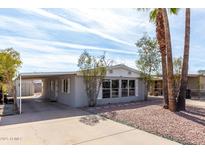 Charming home featuring a covered parking area and desert landscaping at 7645 E Gale Ave, Mesa, AZ 85209