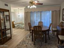 Bright dining area featuring wood table and neutral accents at 459 S Boojum Way, Mesa, AZ 85208