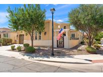 Charming single-Gathering home featuring an American flag, well-maintained landscaping, and inviting curb appeal at 1275 E Verde Blvd, Queen Creek, AZ 85140
