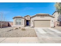 Charming single-story home with a well-manicured desert landscape and a two-car garage at 1316 E Spencer St, Casa Grande, AZ 85122