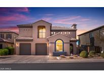 Charming two-story home featuring a tile roof, three-car garage, and manicured landscaping at 22206 N 36Th Way, Phoenix, AZ 85050