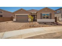 Charming single-story home with a low-maintenance front yard and brick-paved driveway leading to a two-car garage at 25372 N 158Th Ct, Surprise, AZ 85387