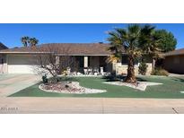 Charming single story home with desert landscaping and an attached garage at 9714 W Terrace Ln, Sun City, AZ 85373