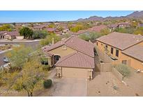 Charming single-story home featuring a well-manicured front yard and tile roof in a serene desert landscape at 10250 E Morning Star Dr, Scottsdale, AZ 85255