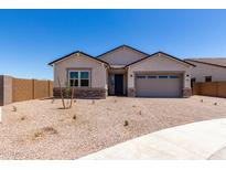 Beautiful single-Gathering home featuring a two-car garage and low-maintenance desert landscaping at 25393 N 158Th Ct, Surprise, AZ 85387