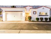 Charming single-story home with white stucco, red tile roof, a two-car garage, and neatly manicured landscaping at 2777 W Queen Creek Rd # 9, Chandler, AZ 85248
