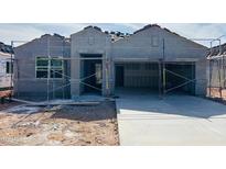 New home construction featuring gray stucco, two-car garage, and desert landscaping at 28228 N Nealite Dr, San Tan Valley, AZ 85143
