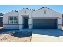Charming single-story home featuring a two-car garage, stucco exterior, and covered front entry at 28228 N Nealite Dr, San Tan Valley, AZ 85143