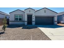 Charming single-story home with a well-maintained front yard and a two-car garage at 28228 N Nealite Dr, San Tan Valley, AZ 85143