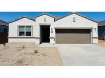 Charming single-story home featuring a neutral color palette, a two-car garage, and low-maintenance desert landscaping at 28228 N Nealite Dr, San Tan Valley, AZ 85143
