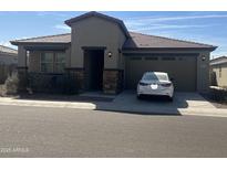 Charming single-story home featuring stone accents and a well-manicured front yard at 3411 W Pollack St, Phoenix, AZ 85041