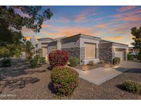 Charming single-story home with manicured landscaping, stone accents, and a welcoming entrance at 3820 E Carson Rd, Phoenix, AZ 85042
