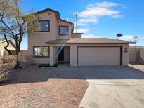 Charming two-story home featuring a two car garage and neutral colored exterior paint at 837 E Minton St, Phoenix, AZ 85042