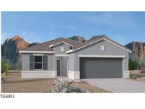 Charming single-story home boasts a two-car garage and desert landscaping at 1361 W Hess Ave, Coolidge, AZ 85128