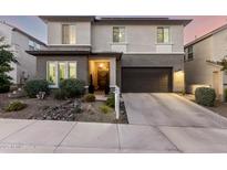 Beautiful two-story home with a well-manicured front yard, inviting entrance, and a spacious two-car garage at 21186 W Hillcrest Blvd, Buckeye, AZ 85396