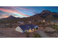 Expansive aerial view showcasing the home's desert setting and mountain views at 2438 N 113Th St, Mesa, AZ 85207