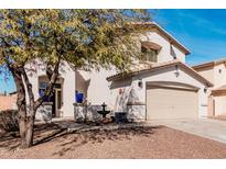 Charming two-story home with desert landscaping, two-car garage, and covered entry at 25732 W St James Ave, Buckeye, AZ 85326