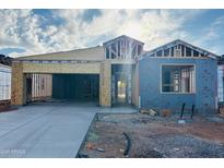New construction home featuring a modern design with an attached two-car garage at 28216 N Nealite Dr, San Tan Valley, AZ 85143