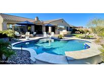 Inviting backyard pool with built-in barbecue and lounge area, perfect for outdoor entertaining at 31709 N 16Th Ave, Phoenix, AZ 85085