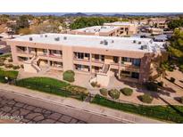 Attractive apartment building with private balconies and well-maintained landscaping, complemented by distant mountain views at 3601 W Tierra Buena Ln # 233, Phoenix, AZ 85053