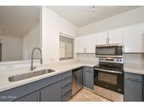 Modern kitchen featuring stainless steel appliances, two-toned cabinets and quartz countertops at 5335 E Shea Blvd # 2126, Scottsdale, AZ 85254