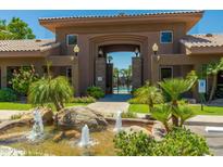 Welcoming entrance to the community, featuring a water fountain, mature landscaping and glimpses of the pool at 7009 E Acoma Dr # 1046, Scottsdale, AZ 85254