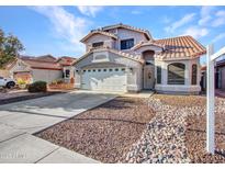 Charming two-story home features a well-manicured front yard, tile roof, and attached two-car garage at 8926 W Lockland Ct, Peoria, AZ 85382