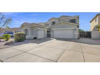 Exterior view of a home featuring an extended driveway and a two-car garage at 10343 E Jacob Ave, Mesa, AZ 85209