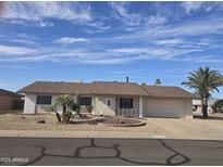 Charming single-story home with a well-manicured desert landscape and inviting curb appeal at 17626 N Buntline Dr, Sun City West, AZ 85375