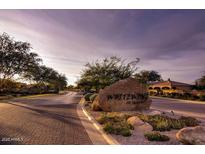 Welcoming entrance to Whitewing featuring lush landscaping and stone signage at 2879 E Portola Valley Ct, Gilbert, AZ 85297