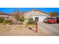 Charming single-story home with well-maintained landscaping and inviting curb appeal in a residential neighborhood at 354 W Bealey Ave, Coolidge, AZ 85128