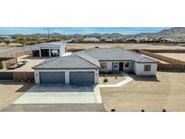 A bright single-Gathering home features a three-car garage and detached garage with mountain views at 711 W Paso Nuevo Dr, Phoenix, AZ 85086