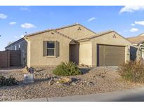 Charming single-story home with desert landscaping and a two-car garage at 864 W Blue Ridge Dr, San Tan Valley, AZ 85140