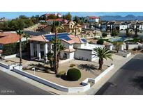 Stunning tile roof home with solar panels, well manicured landscape, and inviting curb appeal at 14401 N 29Th St, Phoenix, AZ 85032