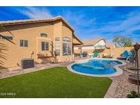 Inviting backyard pool and patio area, perfect for outdoor entertaining and relaxation at 1847 E Milky Way, Gilbert, AZ 85295