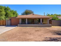 Charming single-story home with a welcoming front porch and a well-maintained yard at 2217 N 37Th Pl, Phoenix, AZ 85008