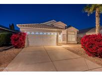 Charming single-story home featuring a well-manicured yard with vibrant bougainvillea at 3522 E Edna Ave, Phoenix, AZ 85032