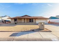 Charming one-story brick home with desert landscaping and a spacious driveway at 3635 W Cortez St, Phoenix, AZ 85029