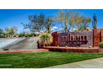 Beautiful brick entrance sign to the Anthem community with green grass and attractive desert landscaping at 37808 N Pagoda Ln, Phoenix, AZ 85086