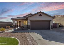 Charming single-story home featuring a tile roof, desert landscaping, and a two-car garage at 37808 N Pagoda Ln, Phoenix, AZ 85086