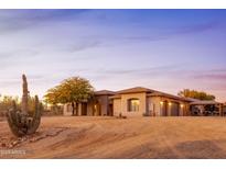 Charming desert home featuring a well-manicured landscape and a desert cactus at 39610 N 12Th St, Phoenix, AZ 85086