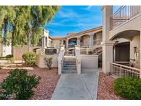 Condo exterior featuring a walkway to the units, patio, and outdoor seating area at 9151 W Greenway Rd # 258, Peoria, AZ 85381