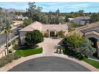 Stunning aerial view of a landscaped property in a cul-de-sac with mountain views at 10125 N 78Th Pl, Scottsdale, AZ 85258