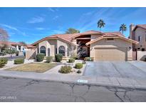 Charming home featuring a well-manicured front yard, two-car garage, and a classic Southwestern design at 13601 S 37Th St, Phoenix, AZ 85044