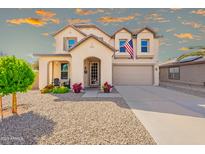 Charming two-story home featuring a well-manicured front yard and traditional design elements at 17722 N 183Rd Ave, Surprise, AZ 85374