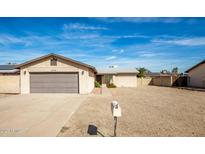 Charming single-story home with brick facade, low-maintenance yard, and attached two-car garage at 2110 W Behrend Dr, Phoenix, AZ 85027