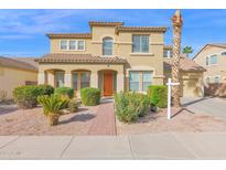 Two-story home featuring a tile roof, stucco exterior, desert landscaping and a brick walkway leading to the front door at 3316 E Kingbird Pl, Chandler, AZ 85286